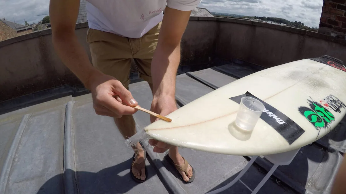damaged surf board in reparation