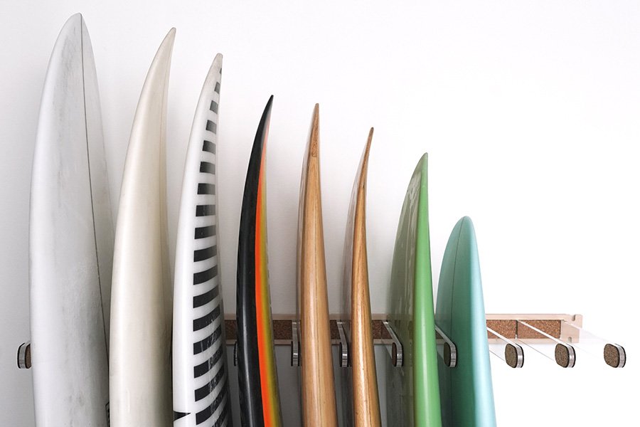 Different surfboards in a surf rack